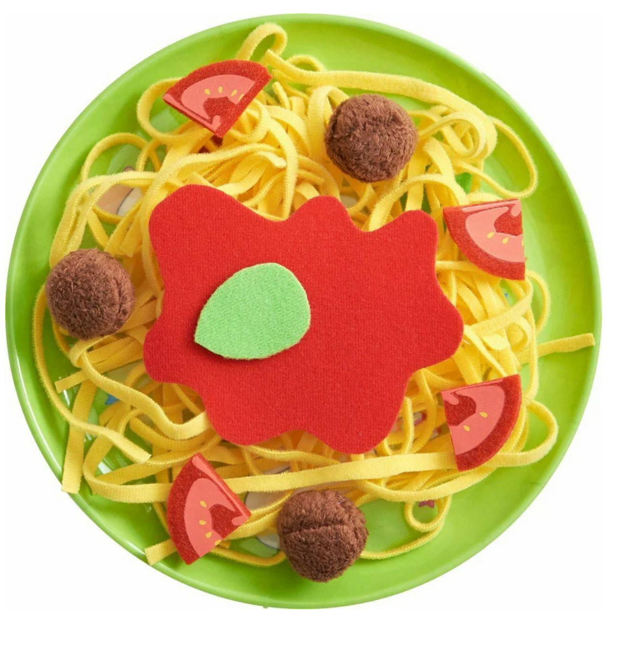 Spaghetti Bolognese play food on green plate with noodles, meatballs, tomato wedges, basil, and sauce.