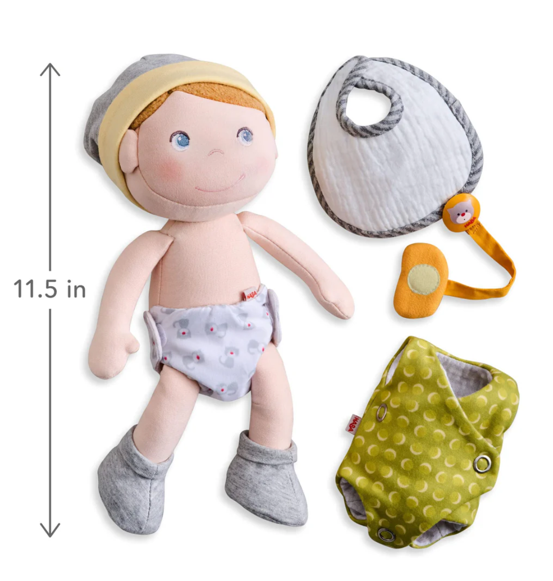 Maxime Baby Doll with reversible diaper, bib, removable socks, magnetic pacifier, and reversible cap, 11.5 inches tall.