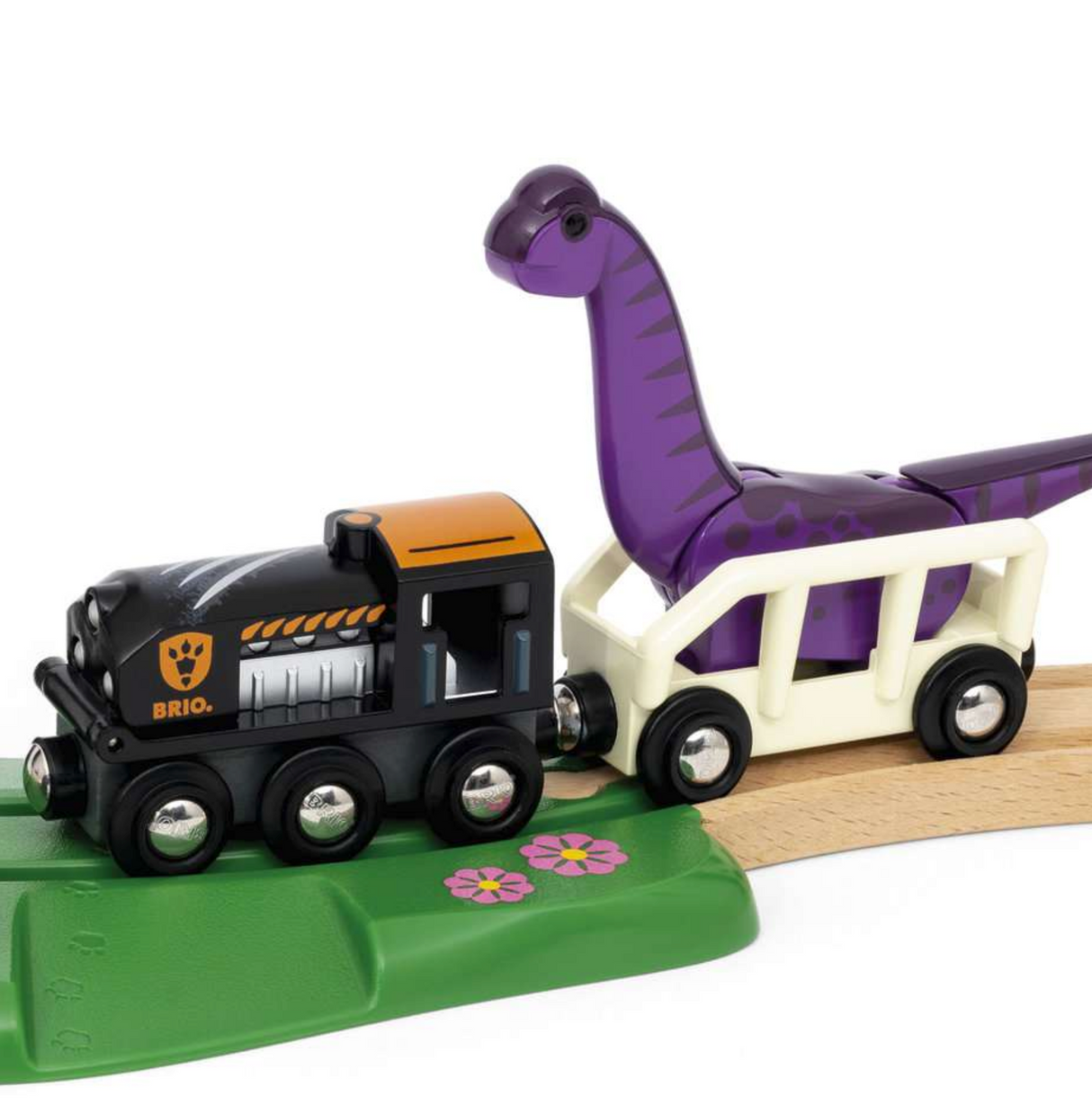 Dinosaur Adventure Set featuring a black train with a purple Brachiosaurus dinosaur on wooden tracks with scenic green base.