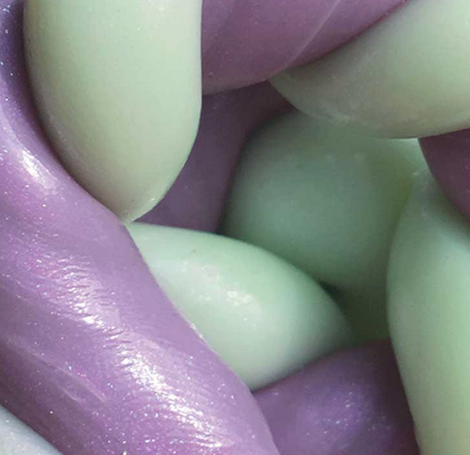 Mini Hello Spring Thinking Putty showing purple and green glitter speckled putty with a smooth, stretchy texture.