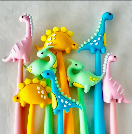Jurassic Dinosaur Wiggle Gel Pen set with colorful dinosaur toppers, perfect for fun and smooth gel ink writing.