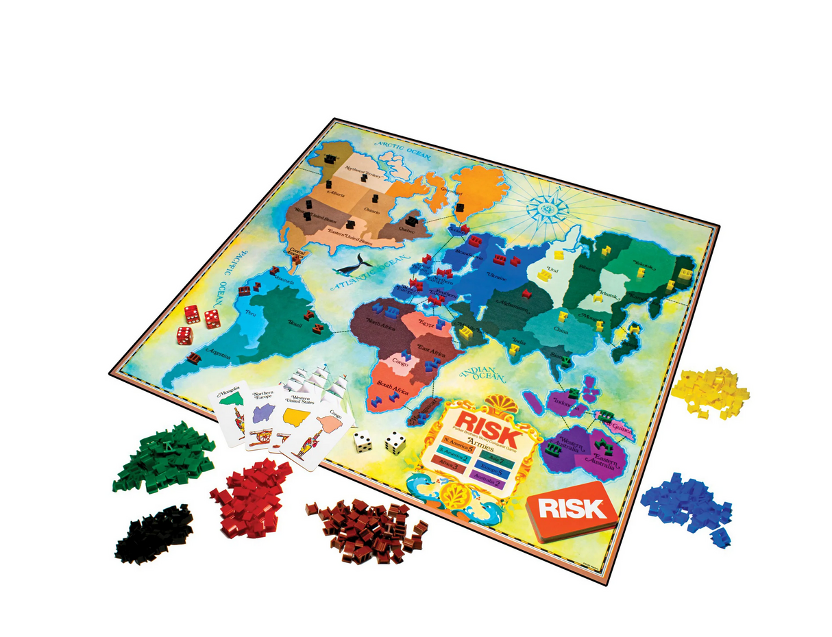 Risk 1980's Edition board game with colorful territories, plastic armies, cards, dice, and game box displayed.
