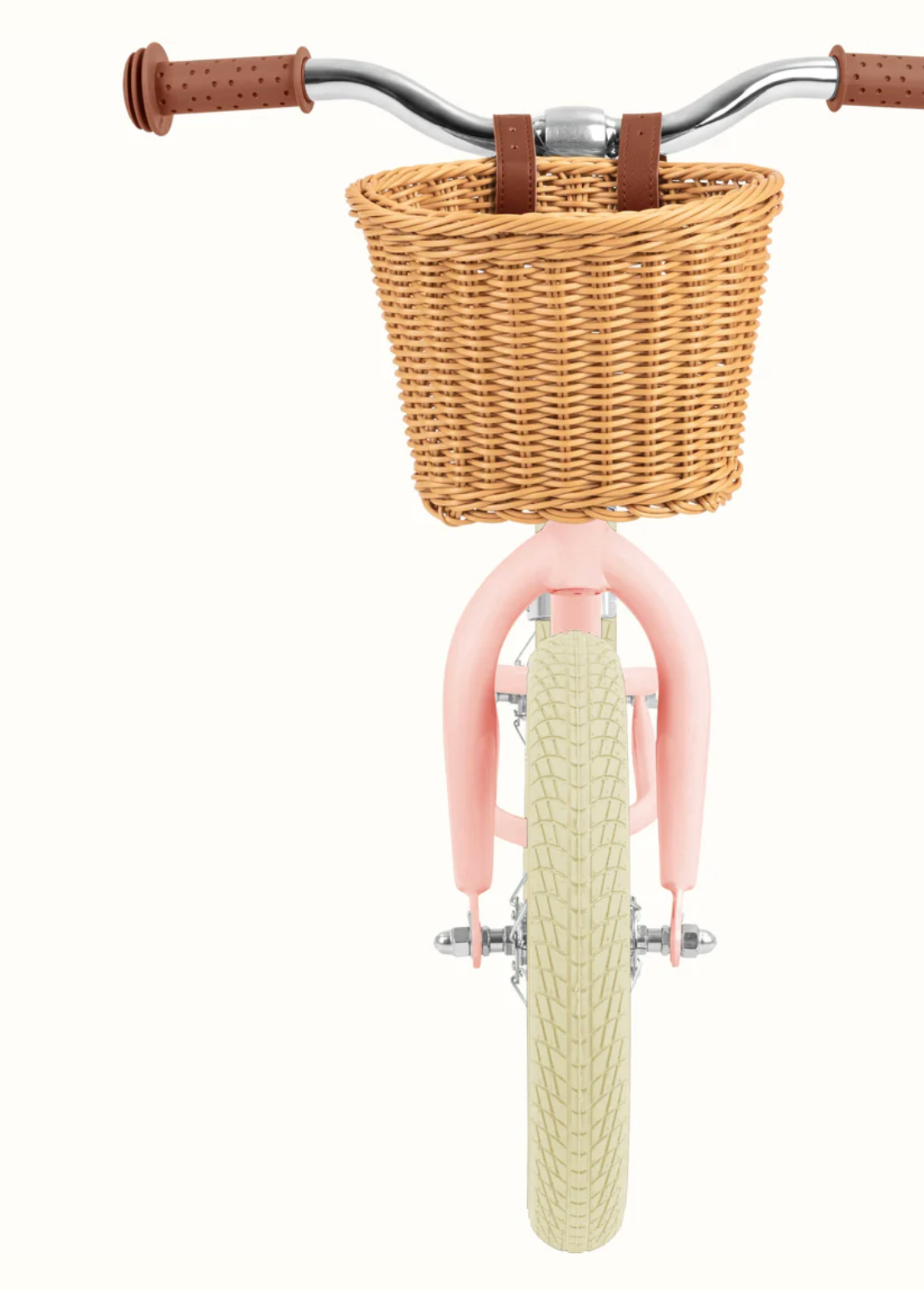 Baby Beaumont Balance Bike | Blush with wicker basket, air-filled tires, and adjustable handlebars for toddlers.