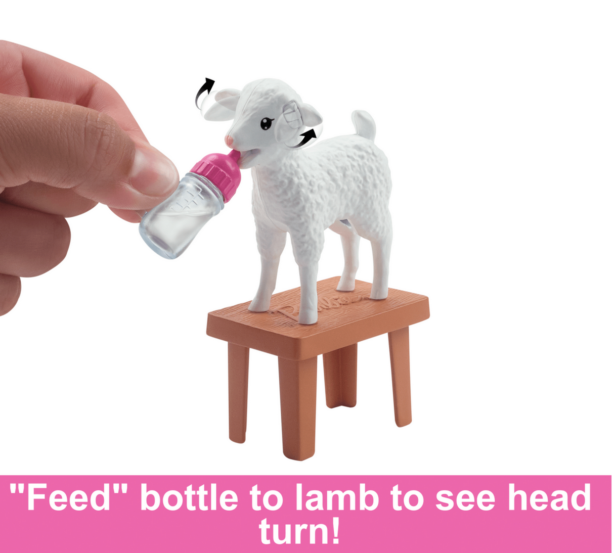 Barbie Livestock Veterinarian lamb toy with interactive wiggling ears being fed from a bottle on a small stool.