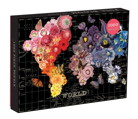 1000pc World Full Bloom Puzzle box featuring vibrant floral and butterfly collage over a black world map background.
