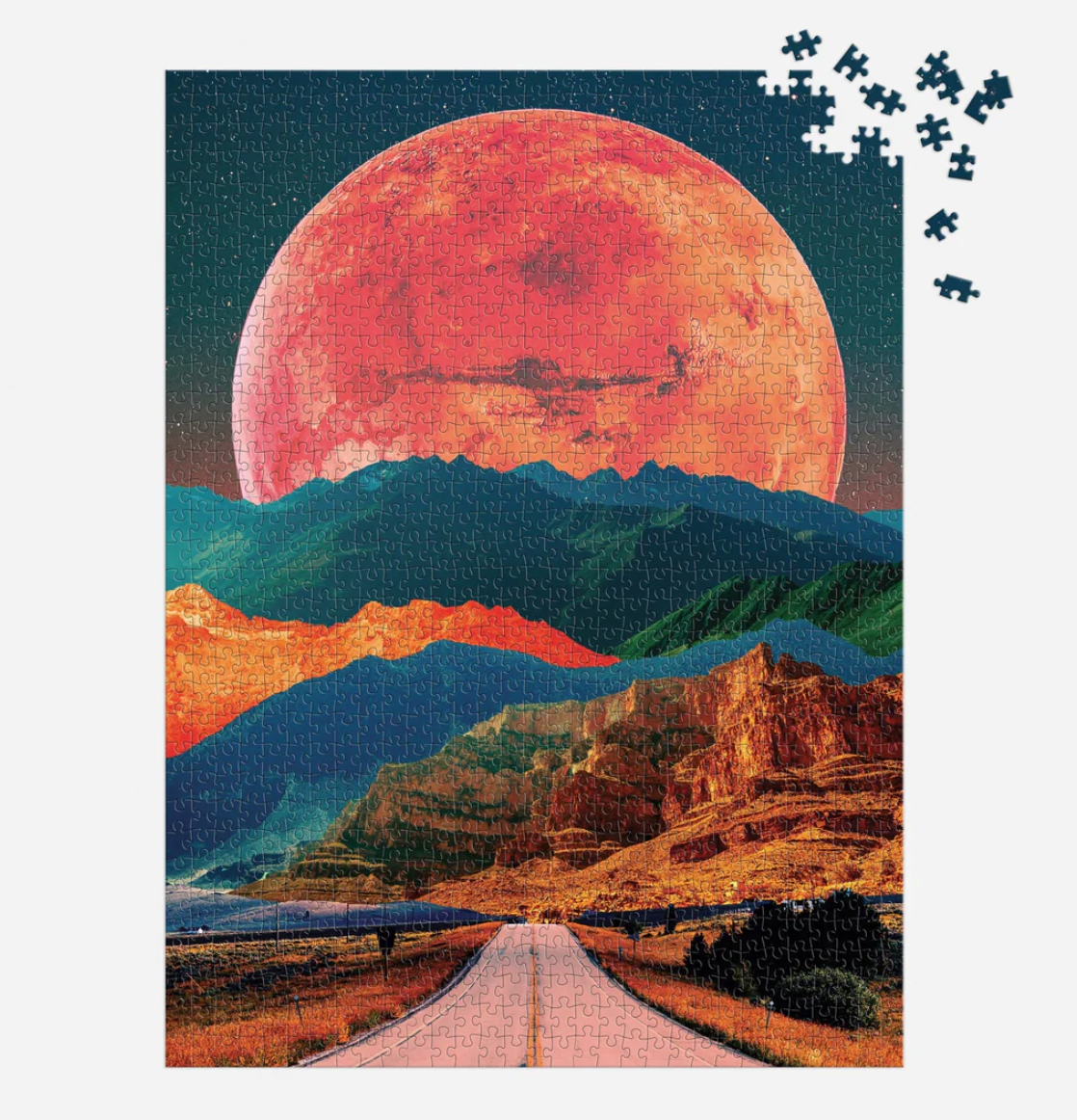 1000pc Cosmic Highway Puzzle showing a surreal desert highway beneath a large red moon with scattered puzzle pieces
