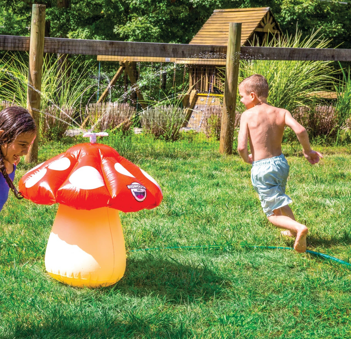 Mini Mushroom Sprinkler inflatable watering kids running and playing in backyard on a sunny day summer fun