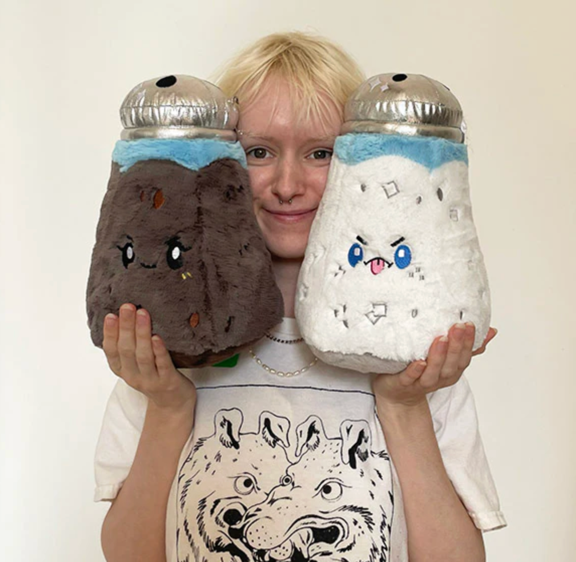 Person holding a plush Pepper Mini with a cute face made of soft polyester fiber, 7x7x10.5 inches.