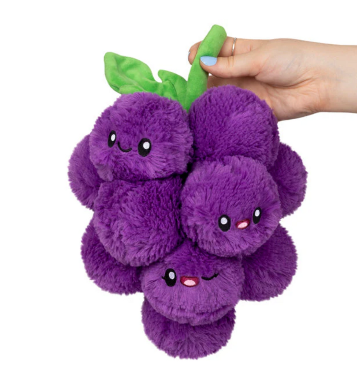 Grapes Mini plush toy with smiling purple grape characters and green leaves, held by a hand, soft and friendly design.