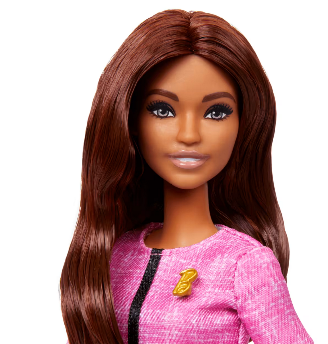 Barbie Future Leader doll with long brown hair wearing pink blazer and gold 'B' pin, inspiring leadership role-play.
