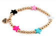 Gold Multi Star Stretch Bead Bracelet with gold beads and colorful star charms in pink, black, white, and turquoise colors.