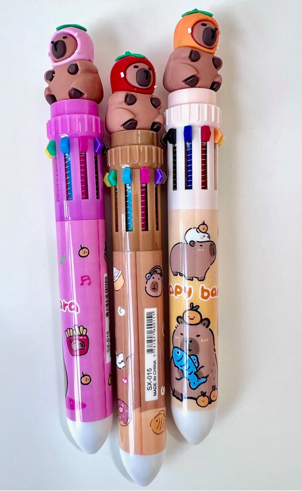10 Color Pen | Capybara with Hat featuring cute capybara figurines and colorful retractable ink options.