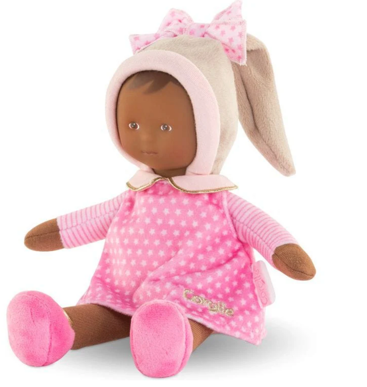 Miss Pink Starry Dreams soft baby doll wearing pink starry dress and bunny hat with stitched label for baby's name.