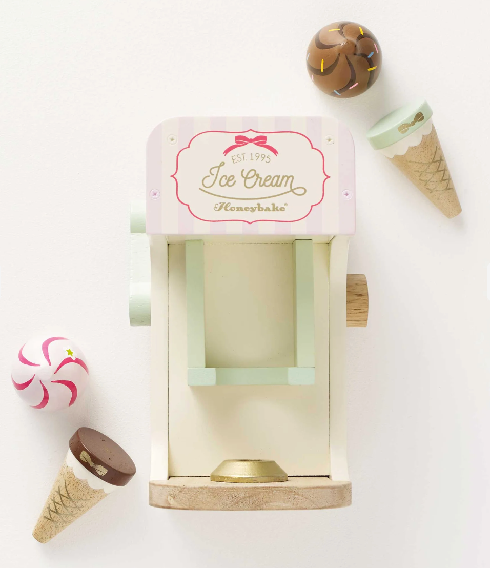 Ice Cream Machine wooden toy with pastel colors, gold accents, and magnetic cones for imaginative play.