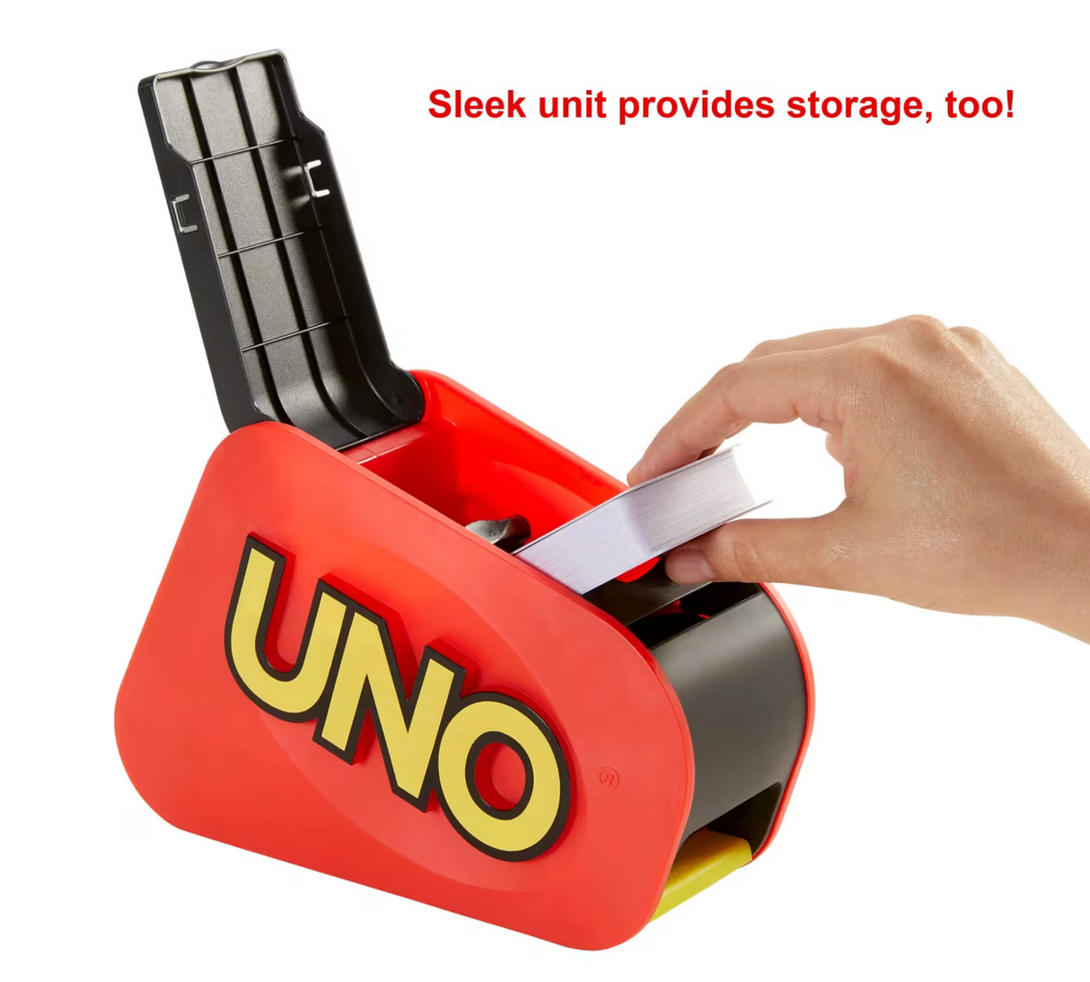Hand placing cards into the card launcher of the sleek UNO Attack game unit with storage compartment open.