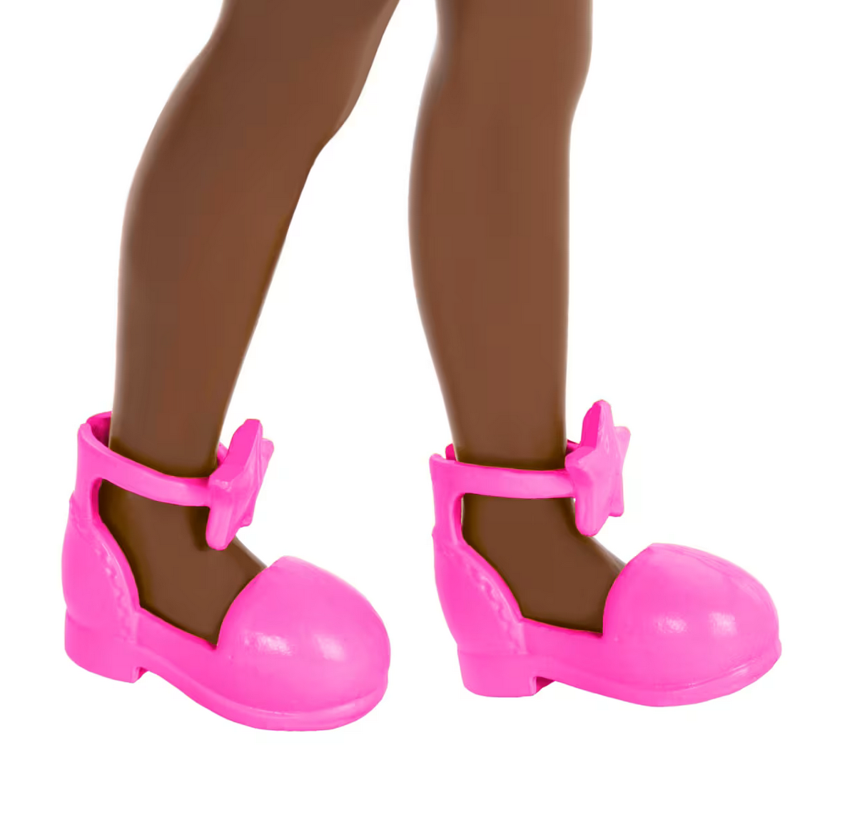 Barbie Chelsea #96 close-up of doll's feet wearing bright pink star shoes with ankle straps on brown legs.