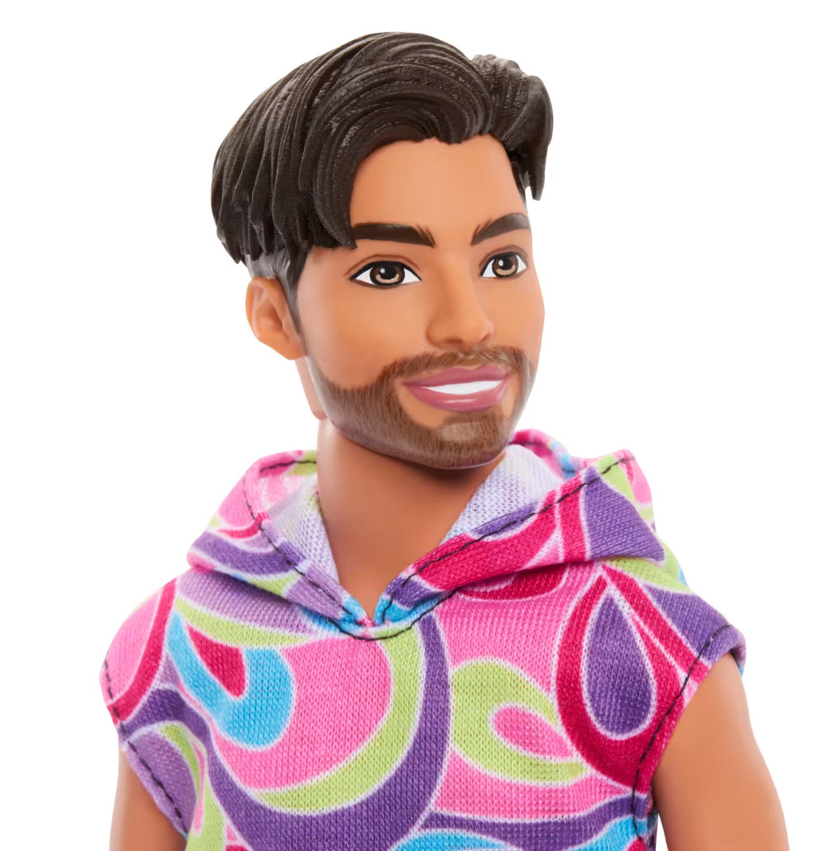 Barbie Fashionista Ken doll with colorful graphic hoodie, sporty style, and trendy modern haircut, smiling and looking to the side.
