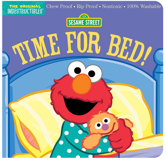 Indestructibles Sesame Street Time for Bed shows Elmo in pajamas hugging a stuffed toy ready for bedtime.