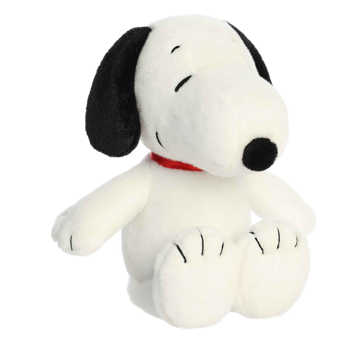 Snoopy Floppy Legs plush in soft white fabric with black ears and stitched details, sitting with floppy legs and red collar.