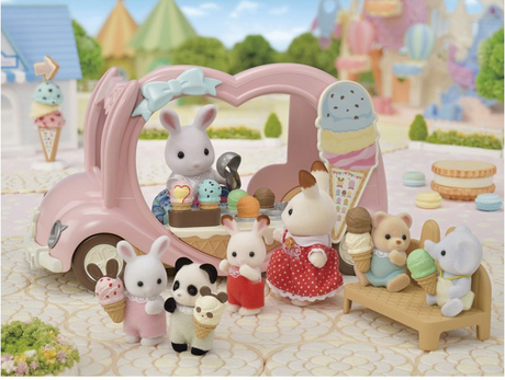 Pink Ice Cream Van toy with animal figures enjoying ice cream cones and accessories in a playful park setting.
