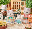 Latte Cat Family set with father, mother, girl, baby cats in colorful checkered outfits and accessories outdoors.