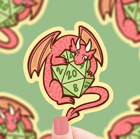 Dragon D20 Sticker shows a pink dragon hugging a green twenty-sided dice, scratch-resistant and weatherproof.