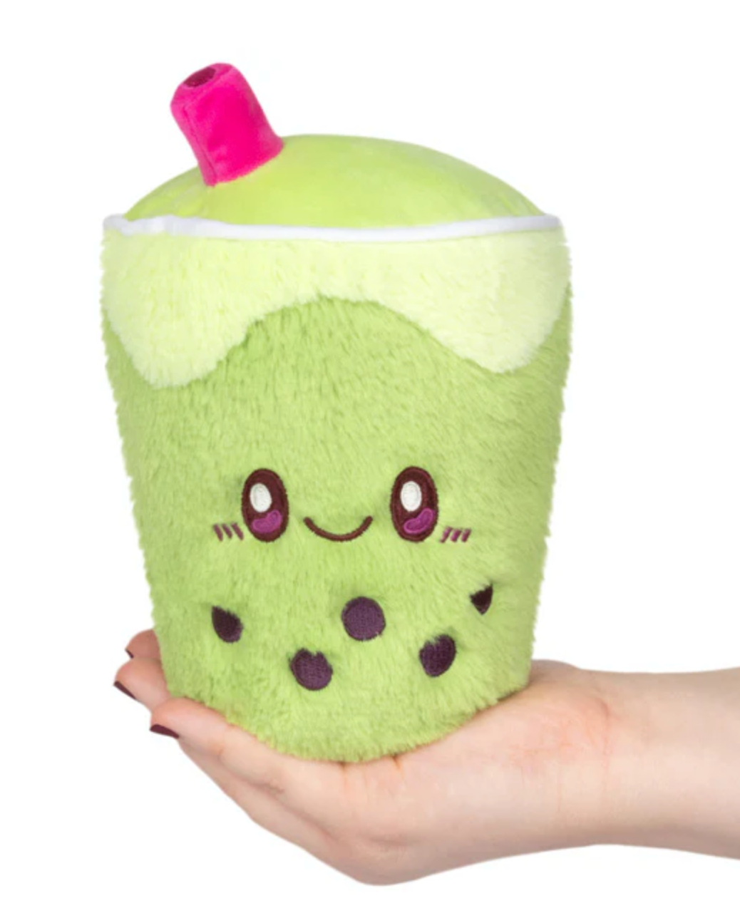Plush green Matcha Bubble Tea Snackers with cute face and pink straw held in hand, soft and cuddly toy.