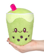 Plush green Matcha Bubble Tea Snackers with cute face and pink straw held in hand, soft and cuddly toy.