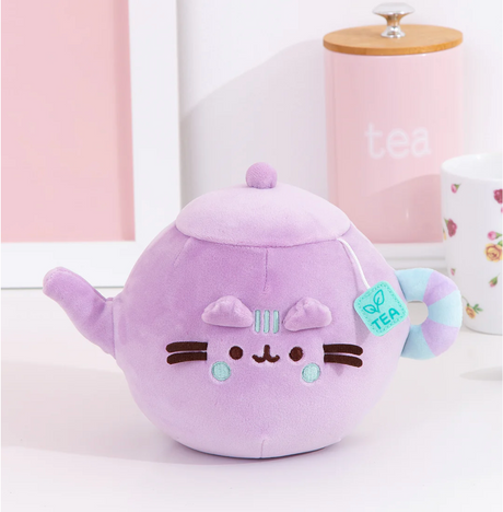Pusheen Tea Pot plush in soft lilac with teal details, a squeezable cute teapot with a felt teabag tag.