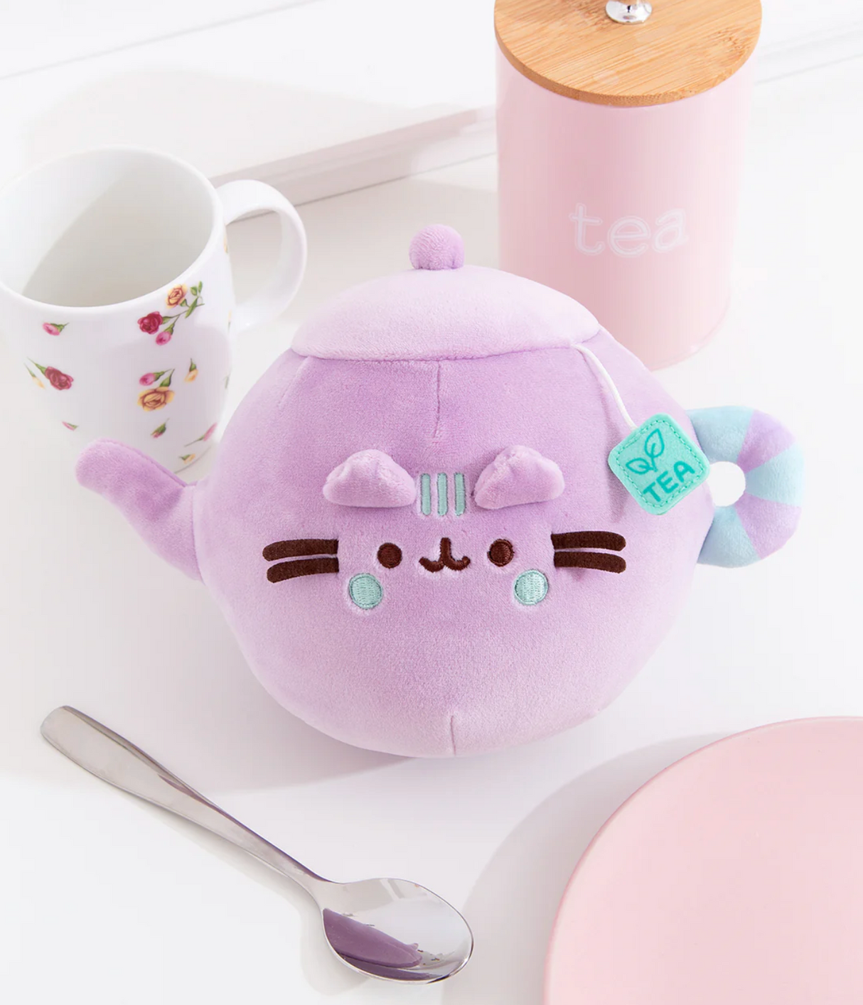 Pusheen Tea Pot plush in soft lilac with teal striped handle and embroidered cute cat face details.