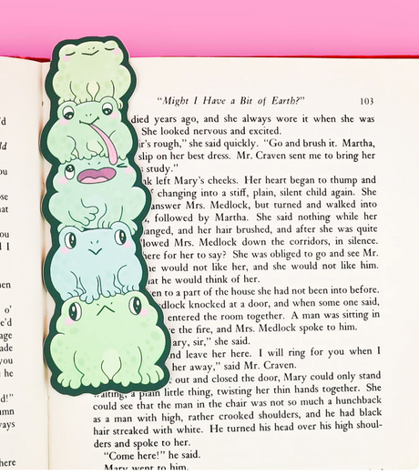 Bookmark | Funny Frog Butts showing a stack of silly frogs marking a book page with a cheeky design.