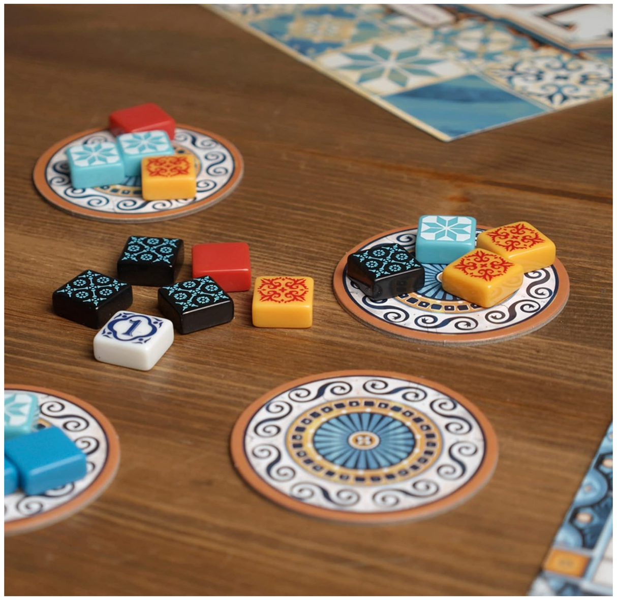 Azul board game with colorful tiles on patterned circular trays ready for mosaic tile placement strategy.
