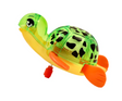 Z Wind Ups | Turtle Topaz, a colorful wind-up swimming turtle toy with bright orange fins and a green spotted shell.