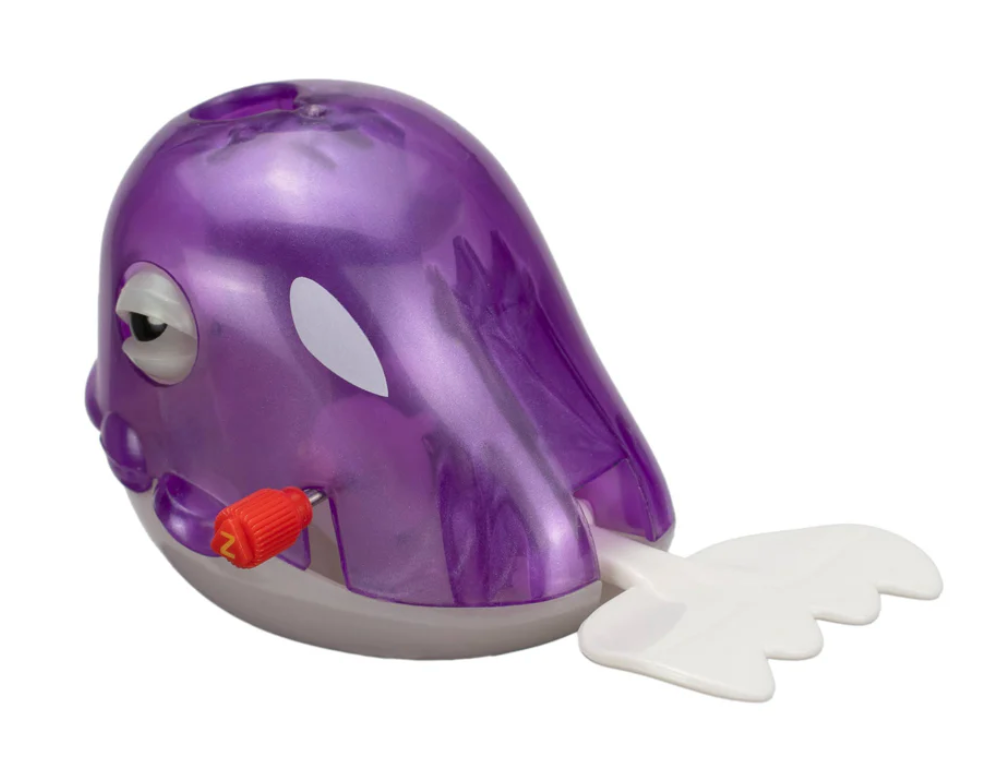 Z Wind Ups | Whale Wilbur purple wind-up swimming whale bath toy with blinking eyes and white tail fin.