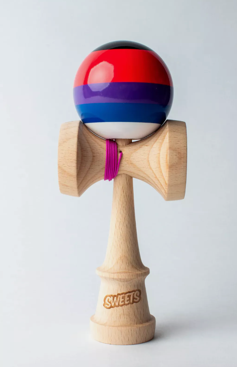 Kendama Prime 5 Stripe | Slushy with colorful striped tama, white bottom, and pink string on natural wood ken.