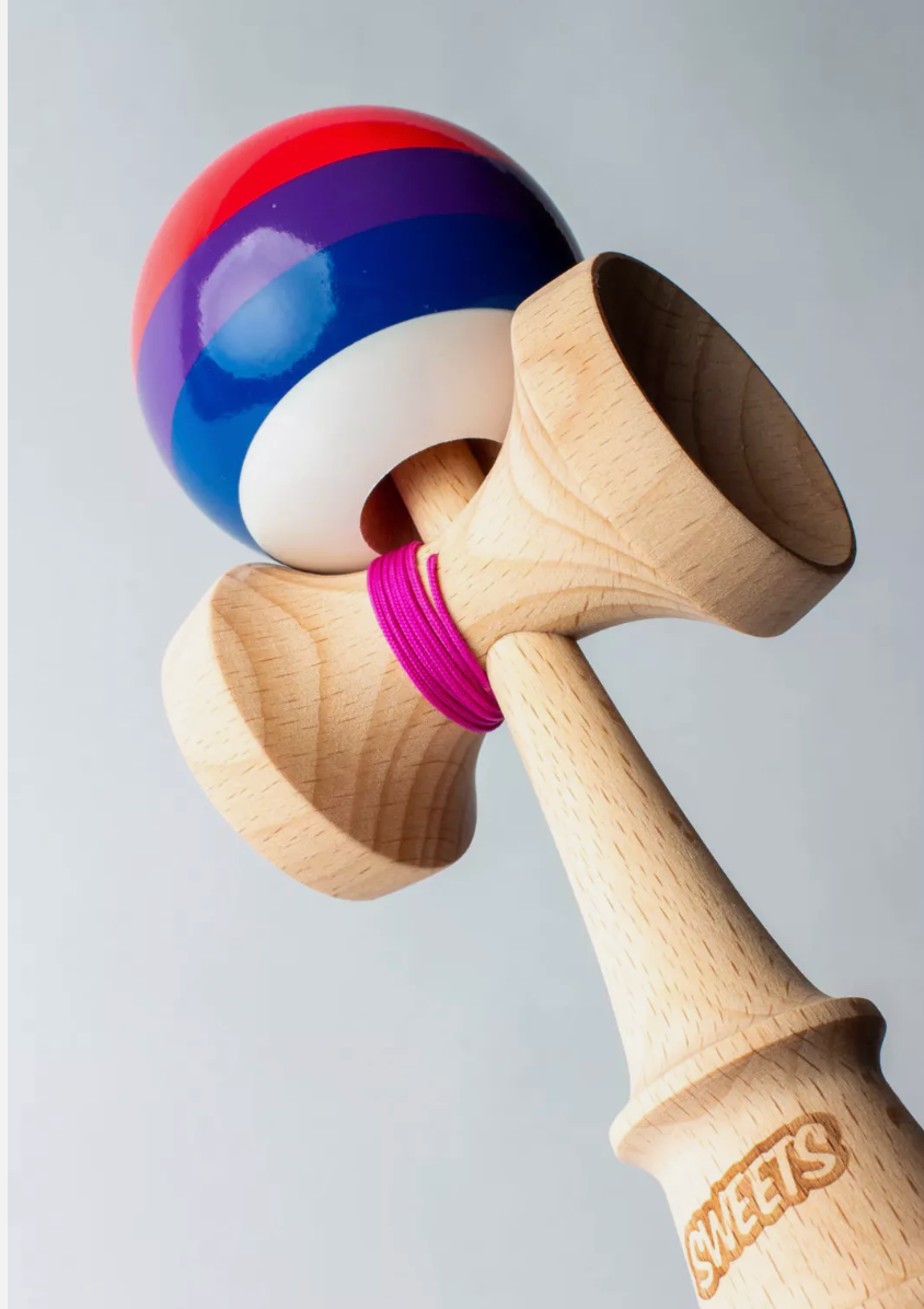 Kendama Prime 5 Stripe | Slushy with colorful striped tama, white bottom, and pink string on natural wood BOOST ken.