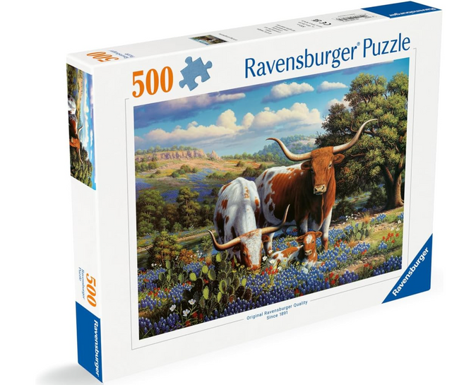 500pc Loving Longhorns Puzzle featuring a mama cow, papa bull, and calf in a scenic Texas landscape with cacti and flowers.