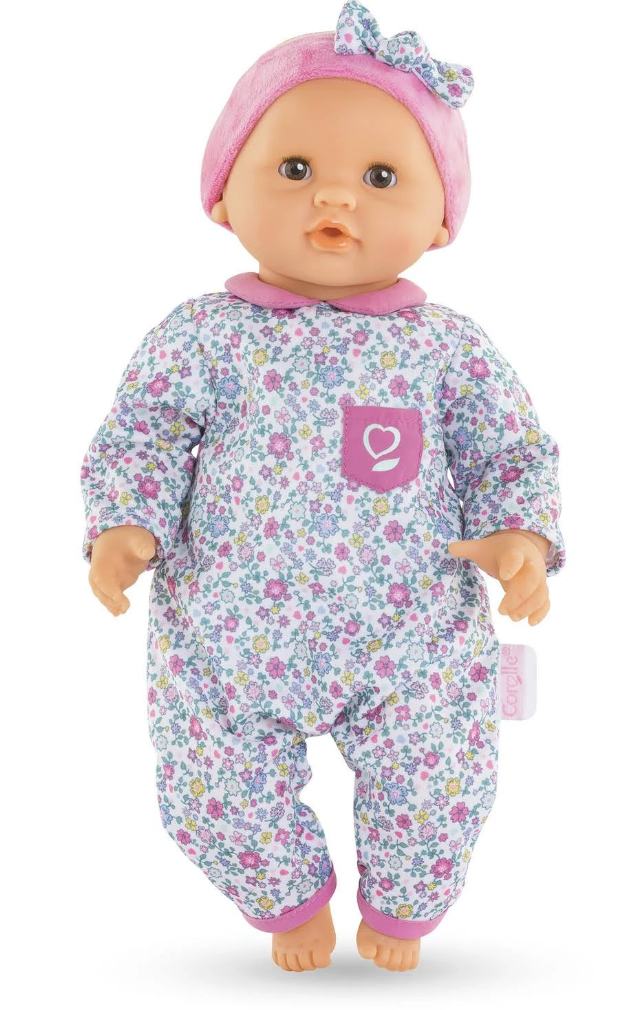 Calin Capucine baby doll with floral outfit, pink hat, posable limbs, and soft vinyl perfect for nurturing play.