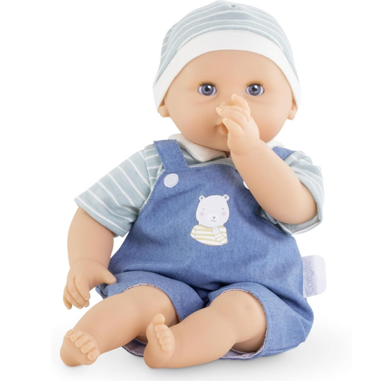 Calin Mael baby doll wearing blue overalls and striped hat, sucking thumb with posable arms and legs.