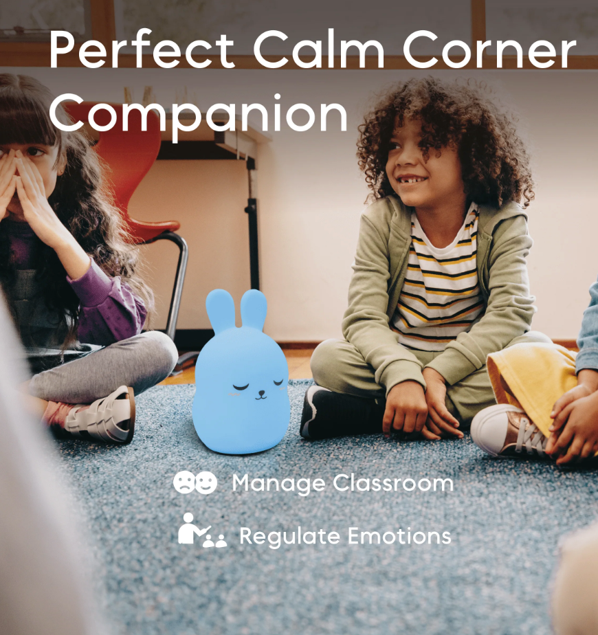 Breathing Pal | Bonnie the Bunny sitting on classroom floor with children creating a calm corner environment.