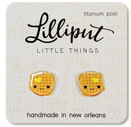 Kawaii Waffle Earrings featuring cute smiling waffles with a glossy finish on a branded card, handmade in New Orleans.