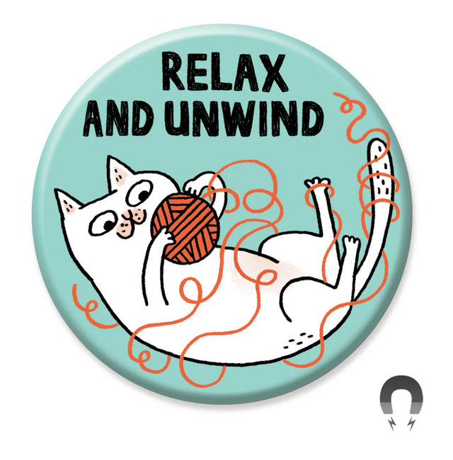 Relax and Unwind Cat Magnet featuring playful white cat with yarn on light blue background, 2.25 inch round design by Gemma Correll.