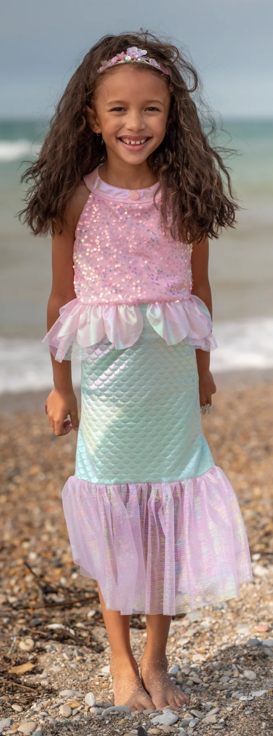 Misty Mermaid Dress | Pink sequin top with sea-shell trim and metallic teal mermaid-style tulle skirt on a smiling girl at the beach.