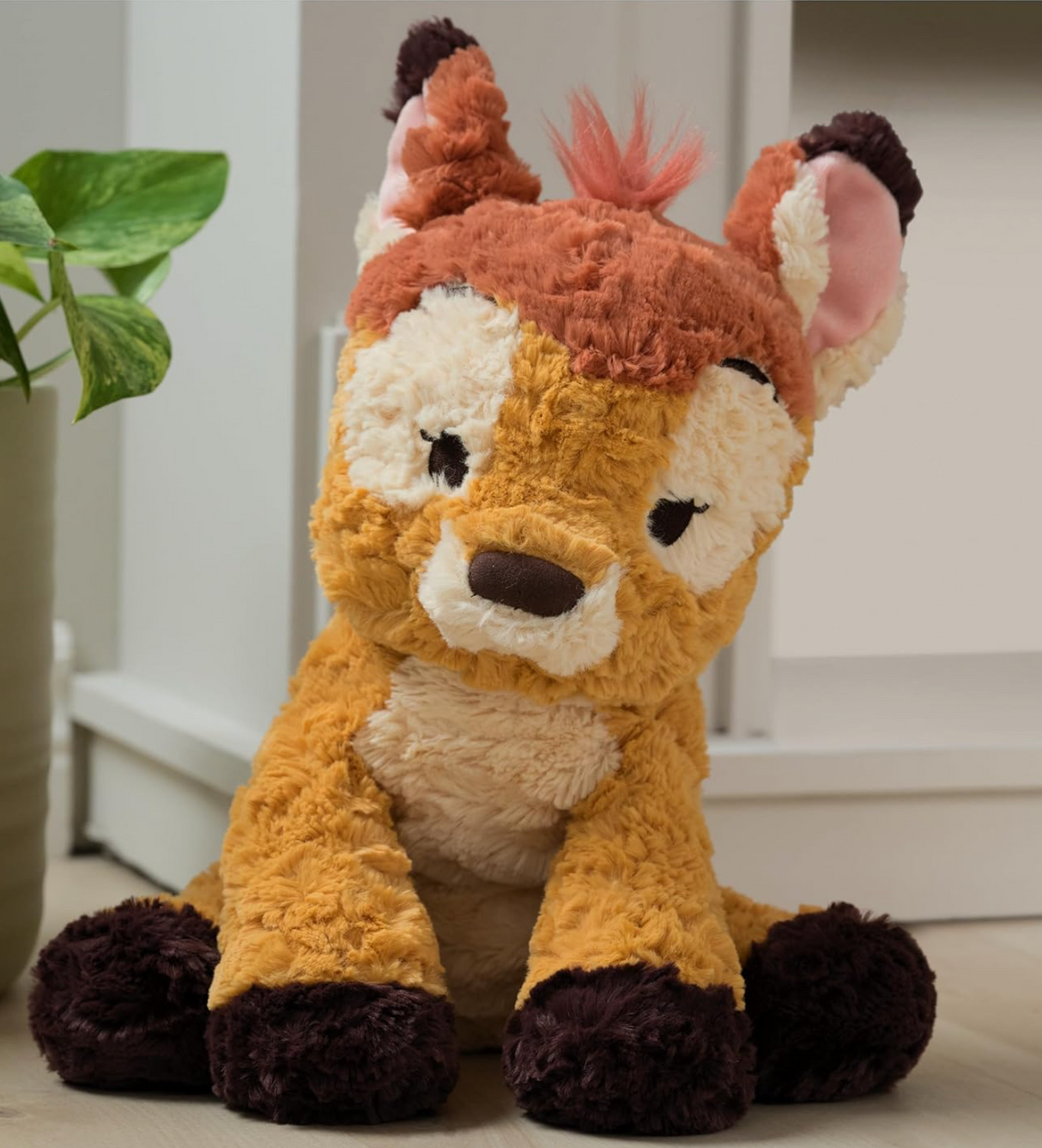 Cozys Bambi plush, a soft, cuddly 10-inch baby deer with textured brown and cream fur, perfect for hugging and snuggling.