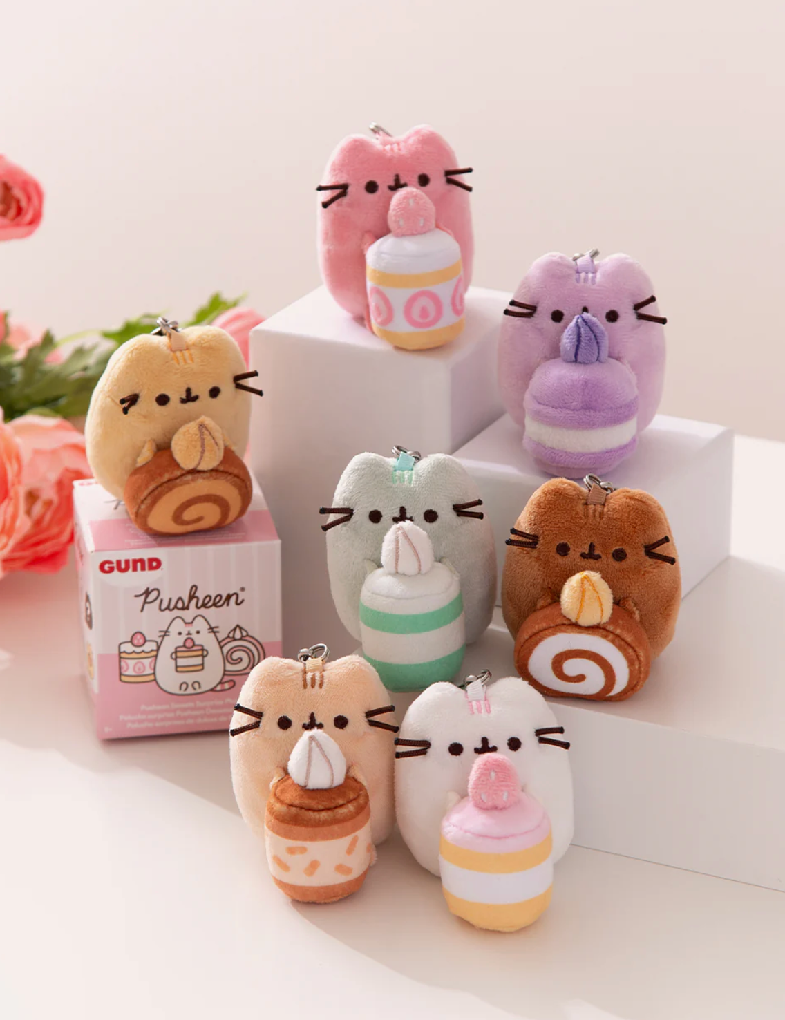 Pusheen Patisserie Blind Box featuring eight cute plush keychains holding assorted dessert cakes.