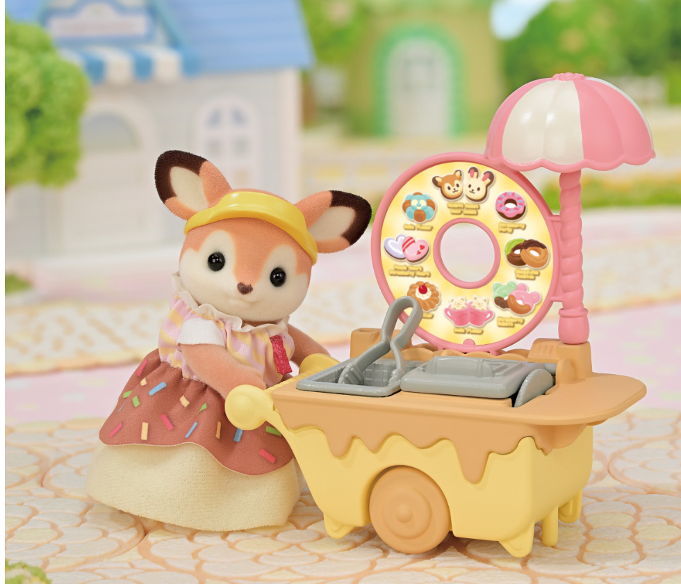 Dip Dip Donuts Wagon with Deer mother figure, donut fryer, and colorful donut accessories in a charming outdoor setting.