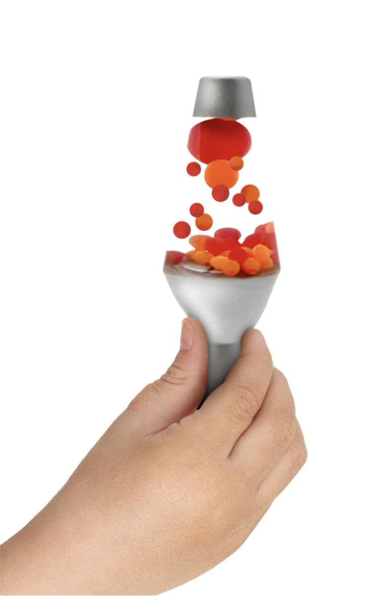 Hand holding Lava Squish n Flow sensory toy with red and orange lava globs flowing inside the small squishy base.
