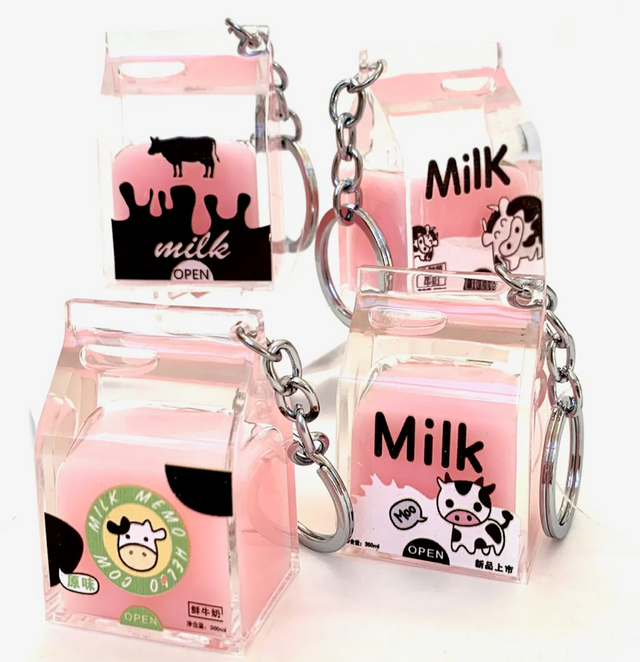 Pink Milk KeyChain featuring a cute pink milk carton design with cow illustrations and a silver keyring.
