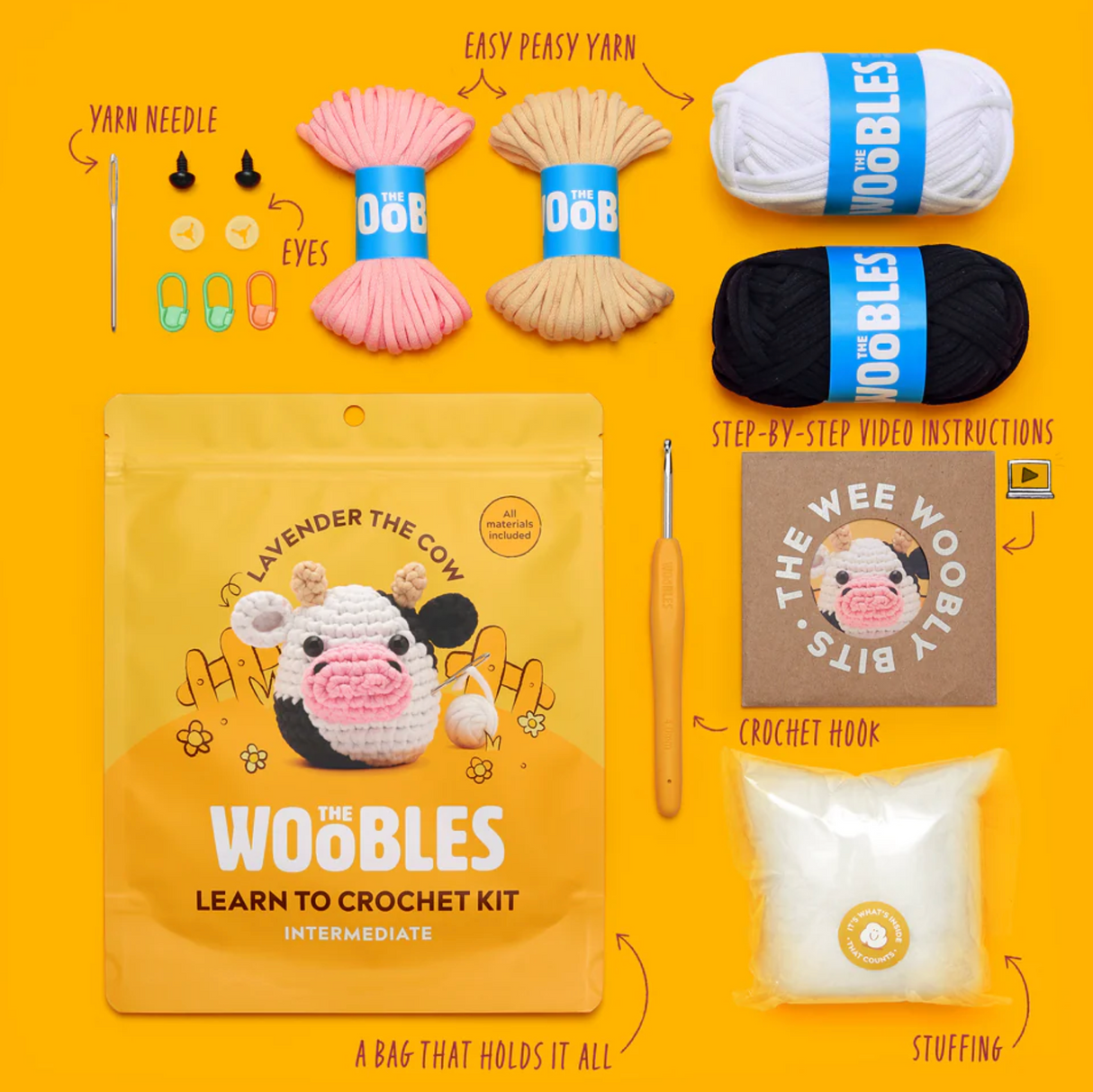 The Woobles Crochet Kit | Lavender the Cow with yarn, crochet hook, stuffing, eyes, needle, and step-by-step video instructions.