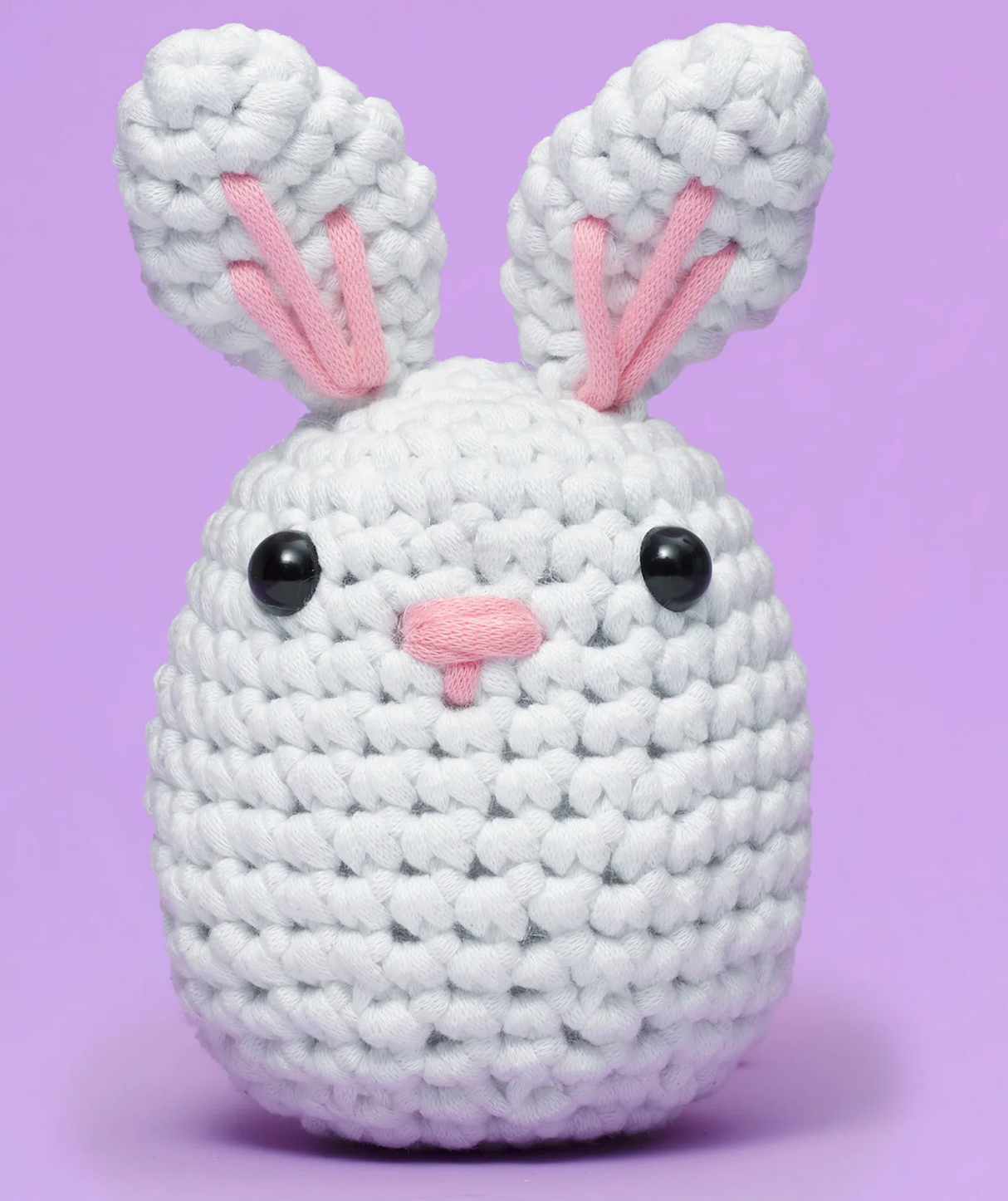The Woobles Crochet Kit | Jojo the Bunny soft white crocheted bunny with pink ears and black eyes on purple background